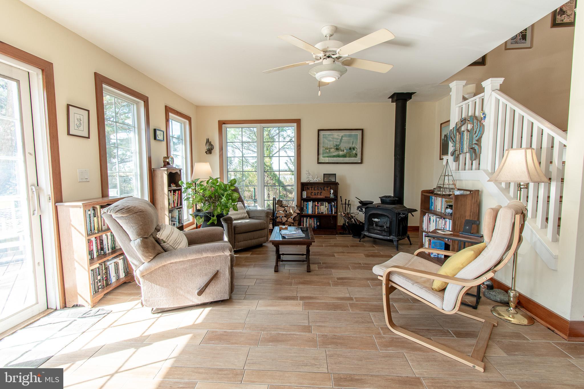 6271 Neavitt Manor Road Neavitt, MD 21652 - Photo 13 of 41 Living area with wood burning stove