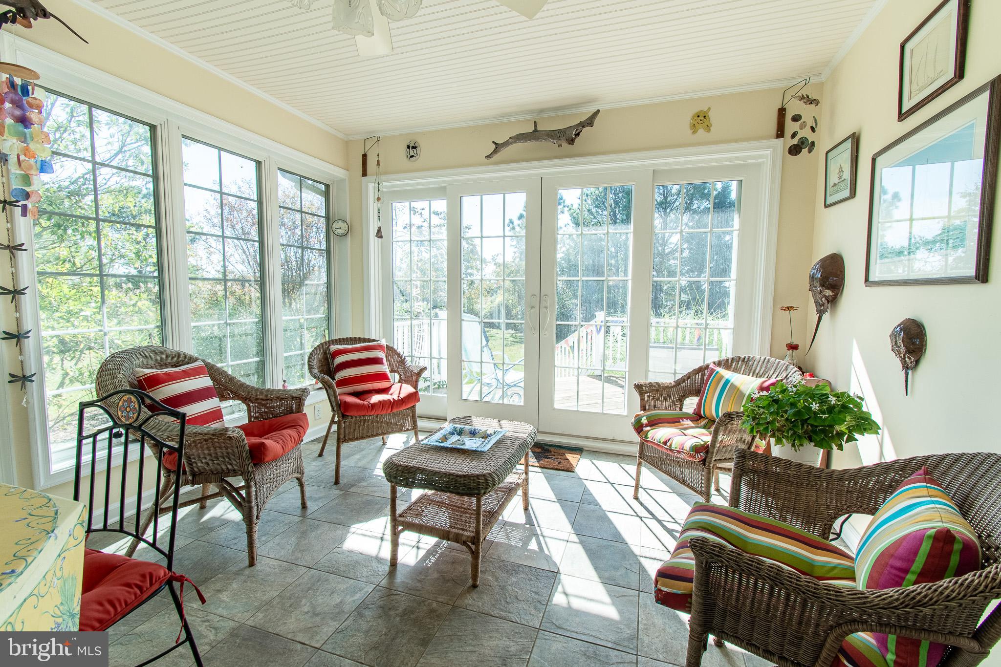 6271 Neavitt Manor Road Neavitt, MD 21652 - Photo 16 of 41 Bright sunlit sunroom, heated tile floor