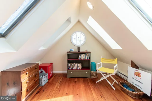 a view of a room with workspace and a window