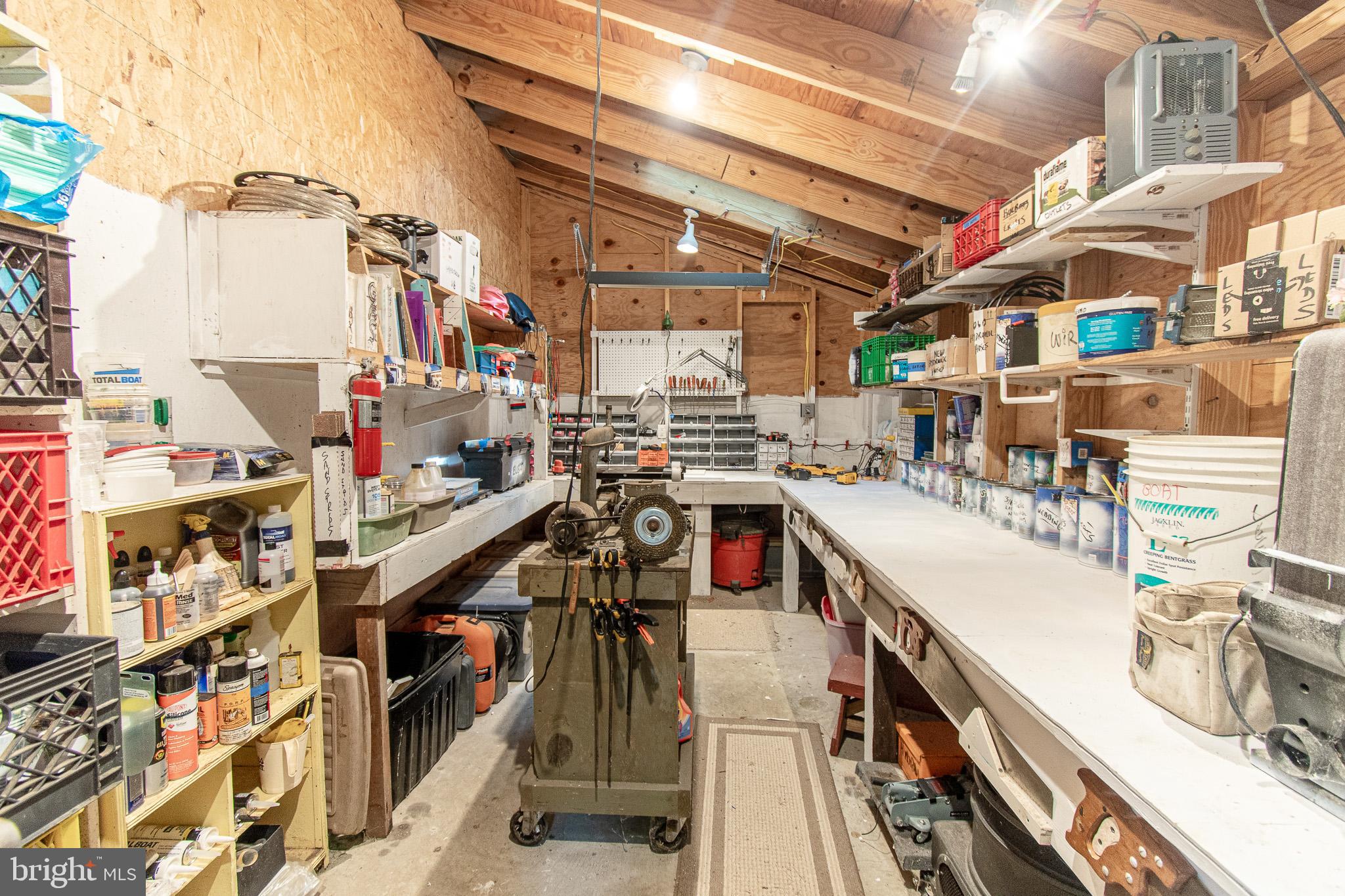6271 Neavitt Manor Road Neavitt, MD 21652 - Photo 36 of 41 Spacious workshop with organized storage.