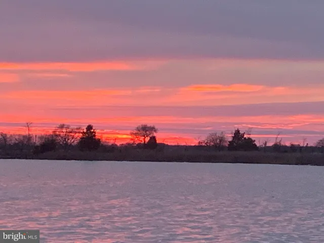 a view of sunset and a lake