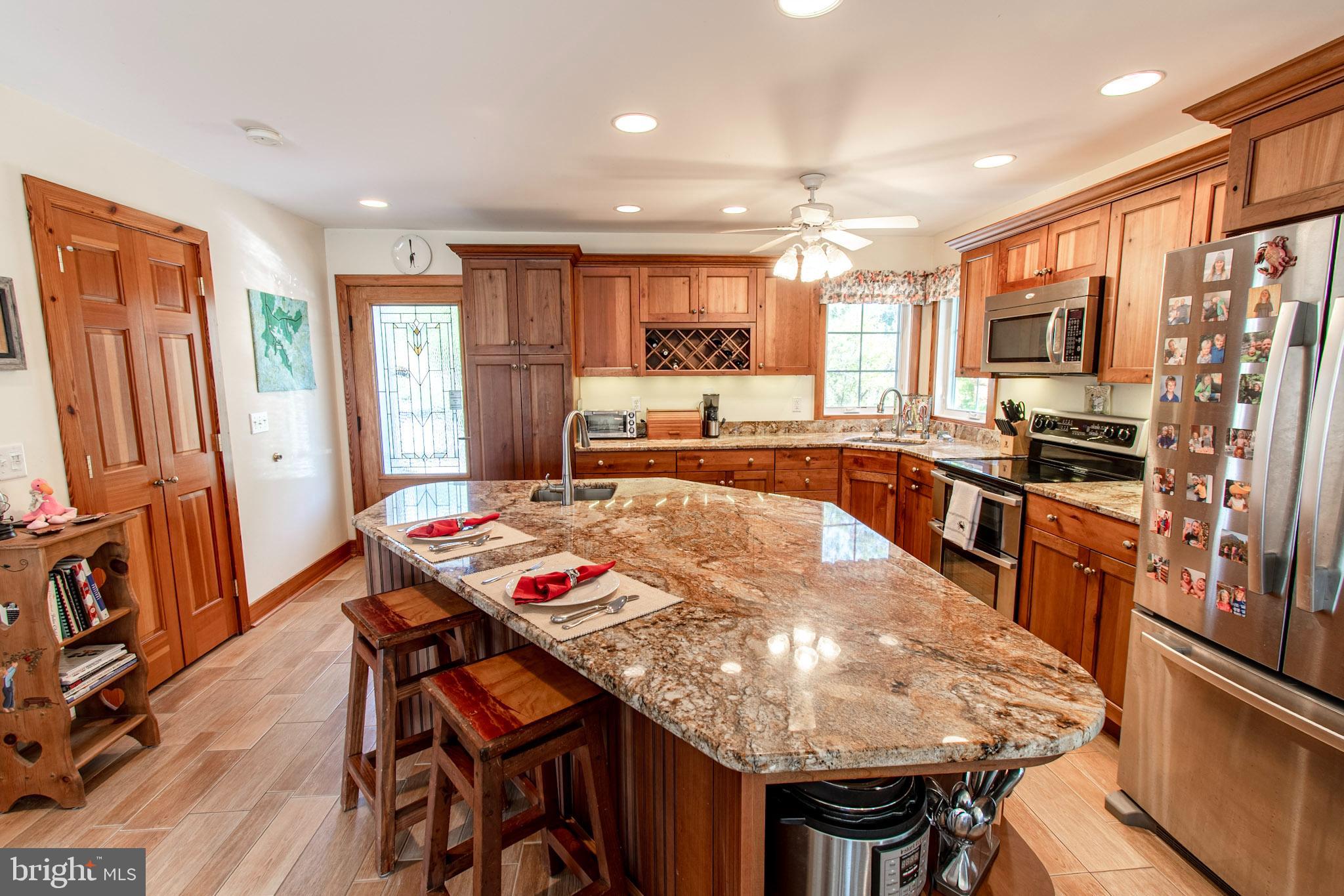 6271 Neavitt Manor Road Neavitt, MD 21652 - Photo 9 of 41 Warm and inviting kitchen w/ island, tile floors