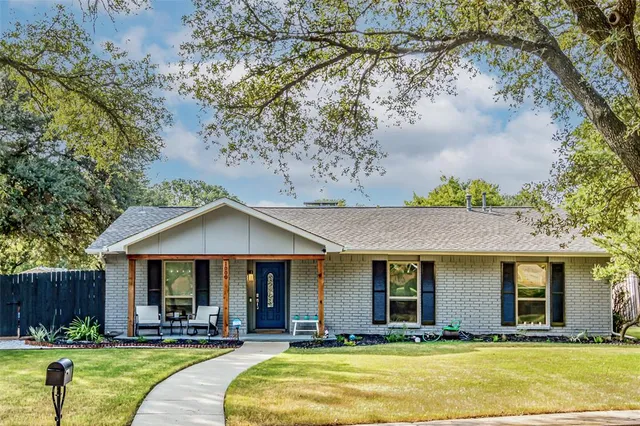 a front view of a house with swimming pool