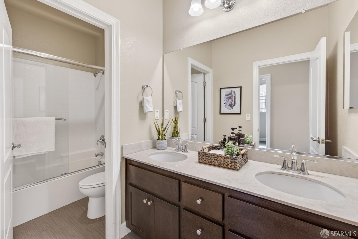 360 Gerald Circle Milpitas, CA 95035 - Photo 31 of 46 a bathroom with a granite countertop sink toilet a large mirror a shower and a bathtub