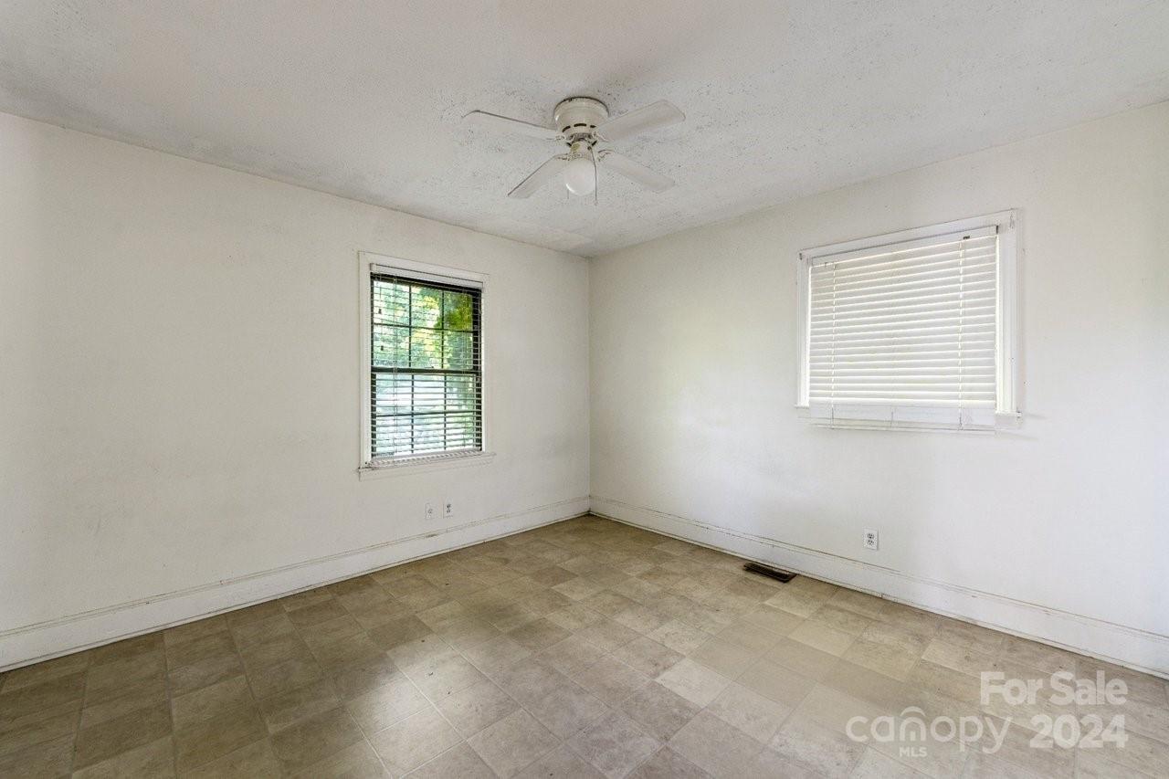 1127 Clanton Road Charlotte, NC 28217 - Photo 12 of 25 a view of an empty room with a window
