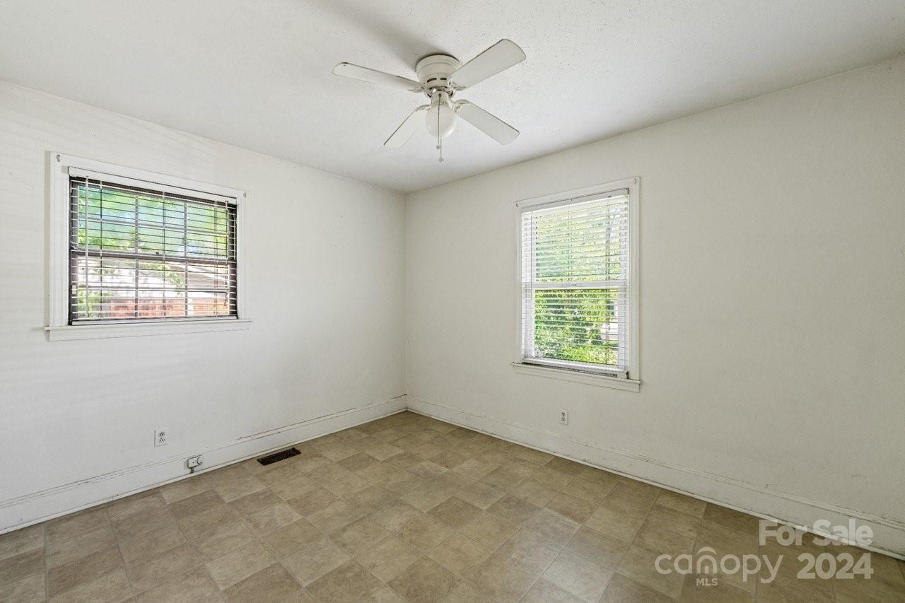 1127 Clanton Road Charlotte, NC 28217 - Photo 13 of 25 a view of an empty room with a window
