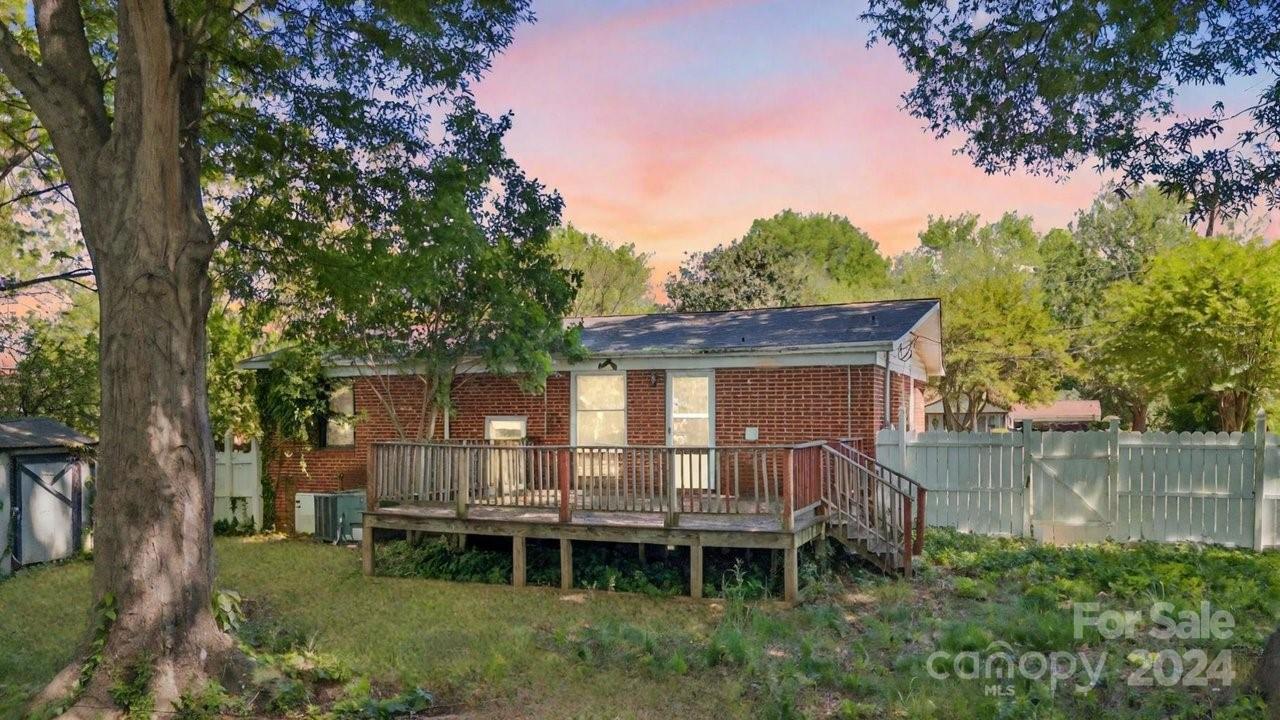 1127 Clanton Road Charlotte, NC 28217 - Photo 16 of 25 front view of a house with a yard