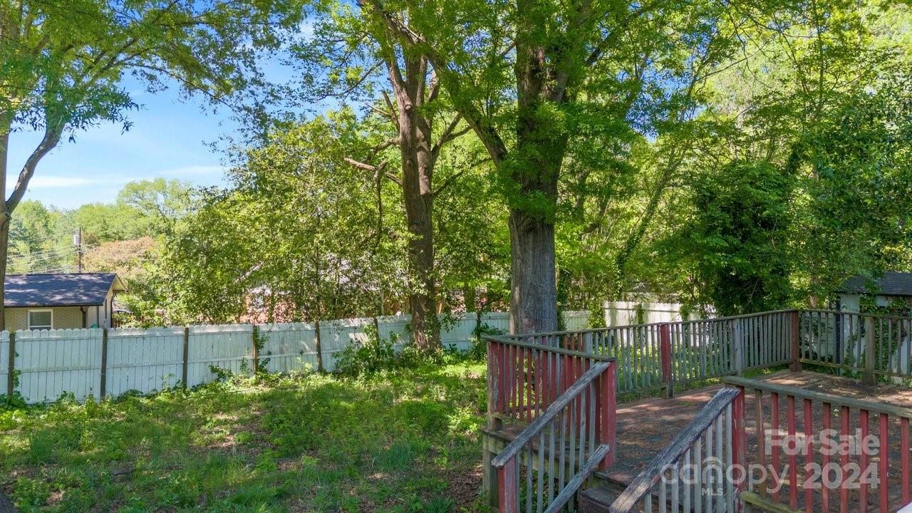 1127 Clanton Road Charlotte, NC 28217 - Photo 18 of 25 a view of street along with trees and trees