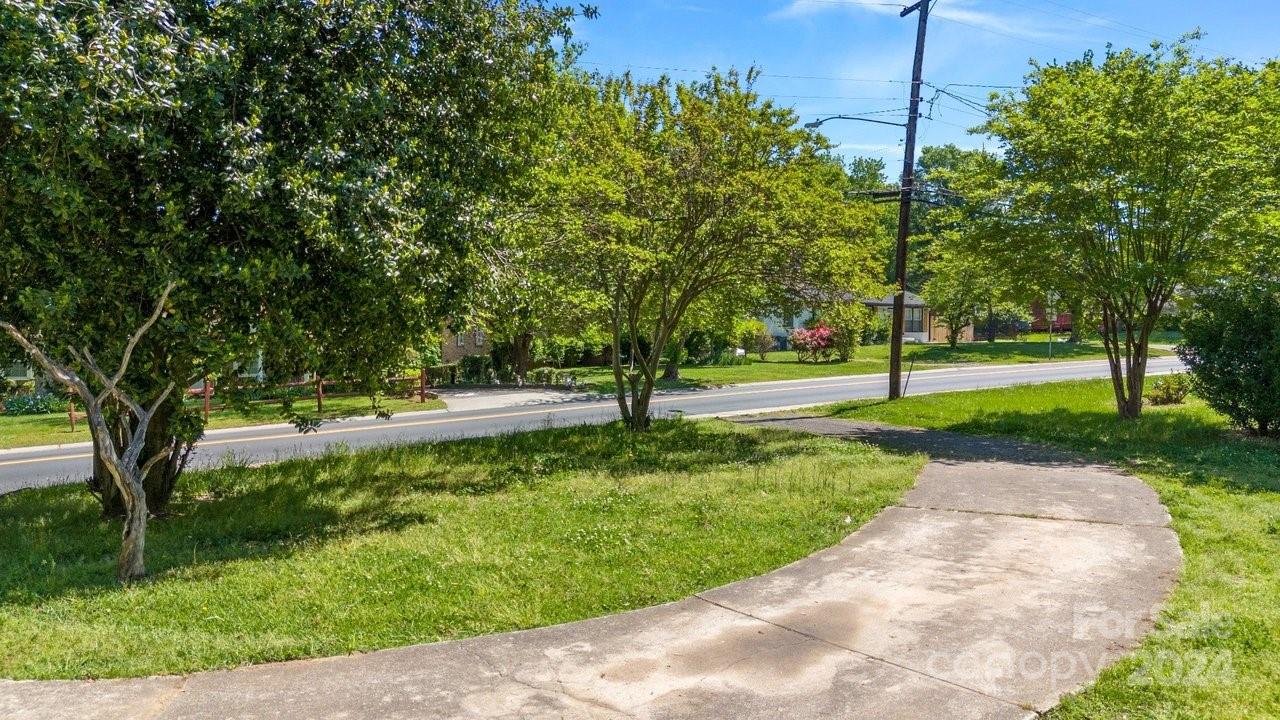 1127 Clanton Road Charlotte, NC 28217 - Photo 23 of 25 a view of a garden with trees