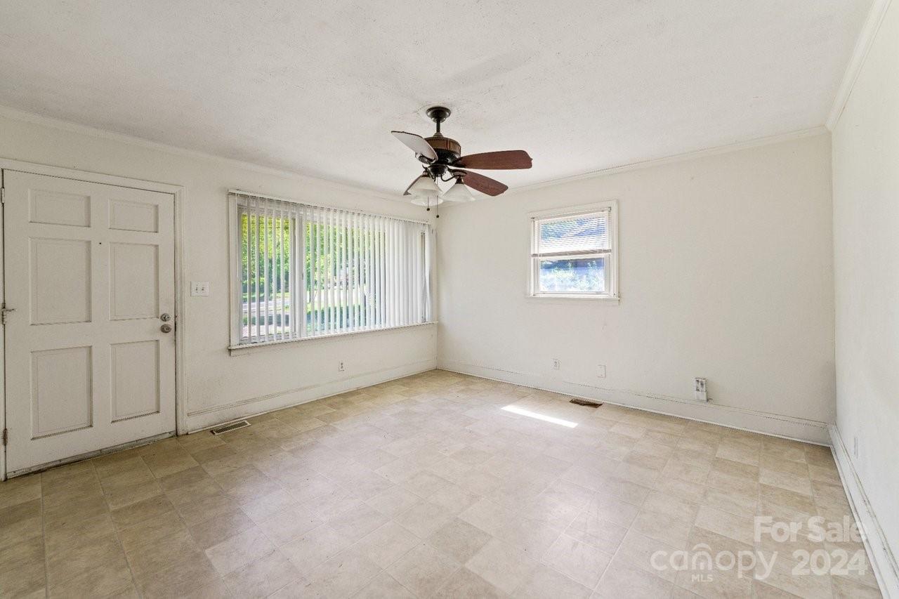 1127 Clanton Road Charlotte, NC 28217 - Photo 4 of 25 a view of an empty room with a window