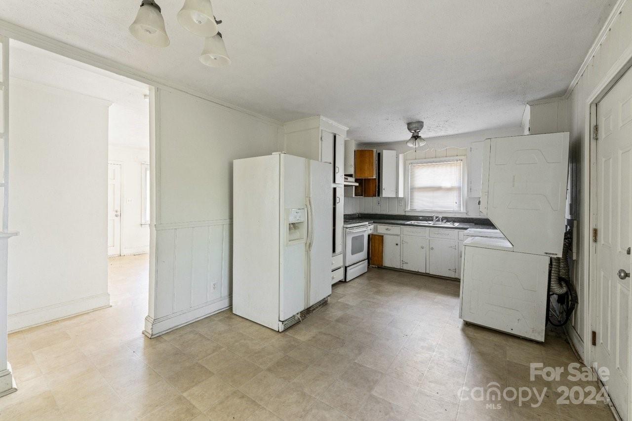 1127 Clanton Road Charlotte, NC 28217 - Photo 7 of 25 a kitchen with a refrigerator a sink and dishwasher