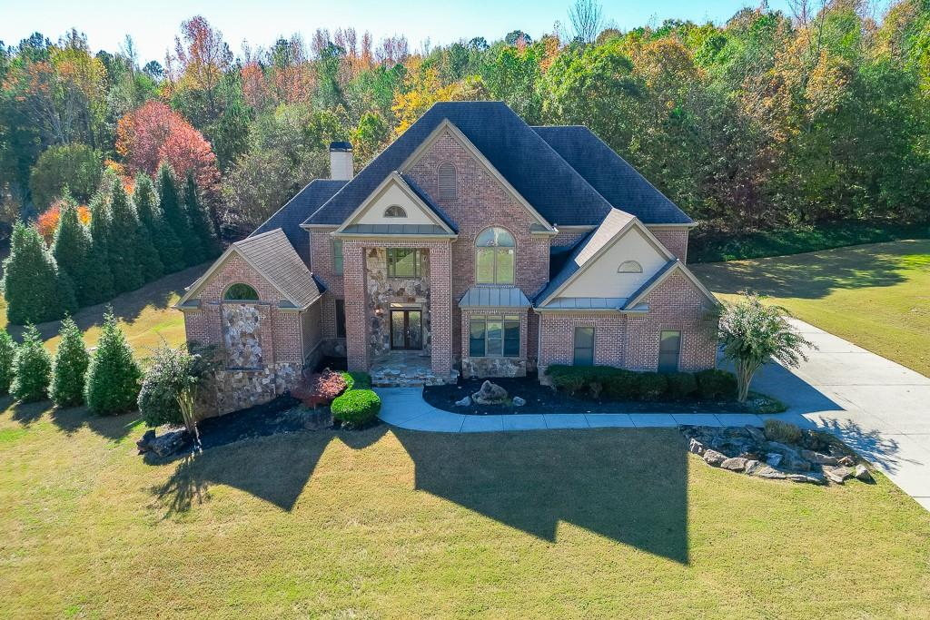940 Chateau Forest Road Hoschton, GA 30548 - Photo 83 of 87 a view of house with garden space and swimming pool