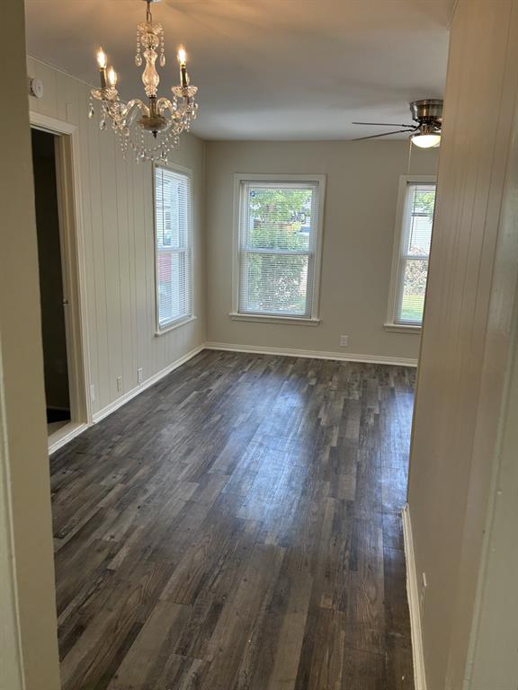 6318 Belgrade Avenue Dallas, TX 75227 - Photo 7 of 23 wooden floor in an empty room with a window