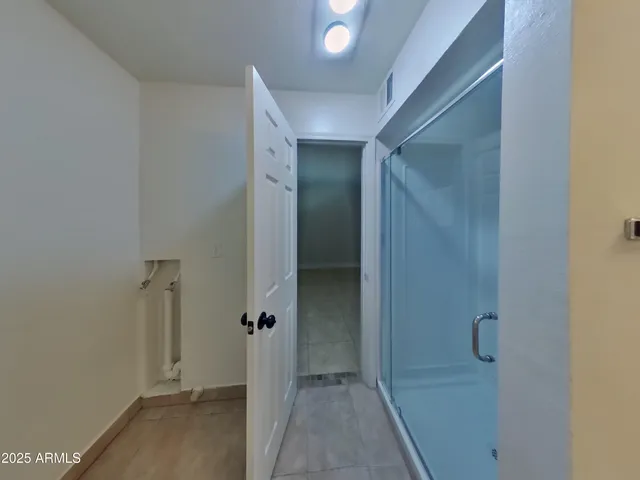 a view of an empty room and fire place