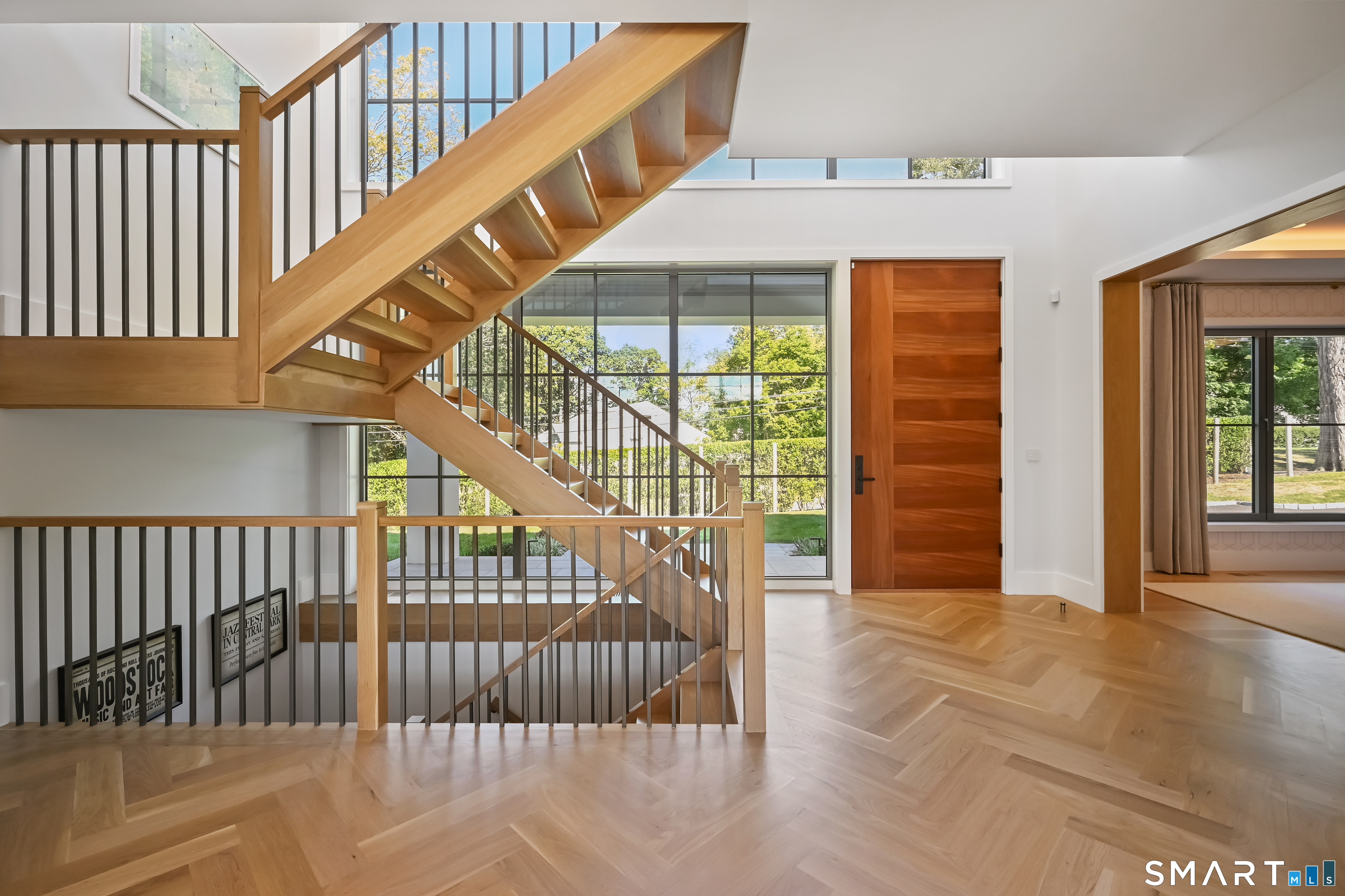 143 Roseville Road Westport, CT 06880 - Photo 10 of 14 a view of staircase with white walls and windows