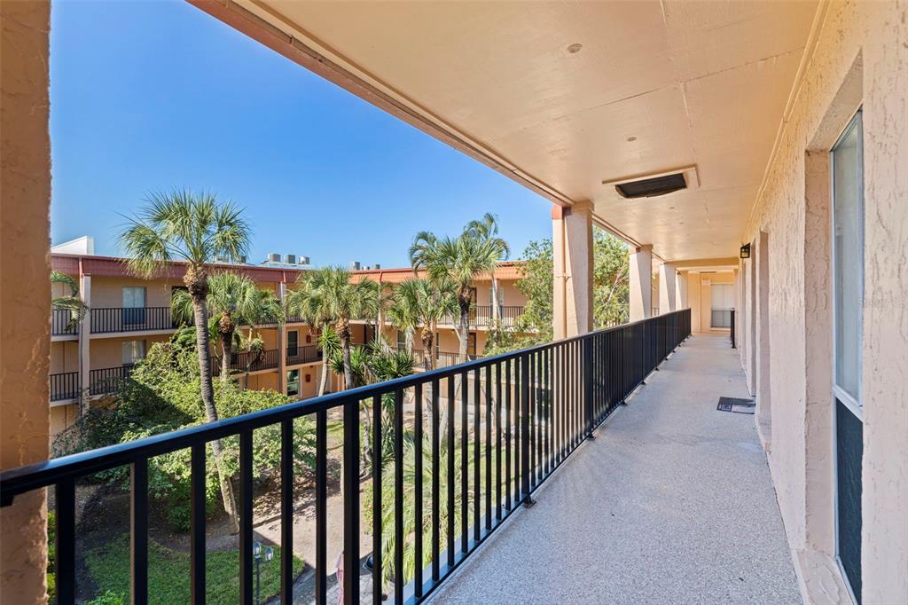 8911 Blind Pass Road, Unit 319 St. Pete Beach, FL 33706 - Photo 4 of 29 a view of a balcony