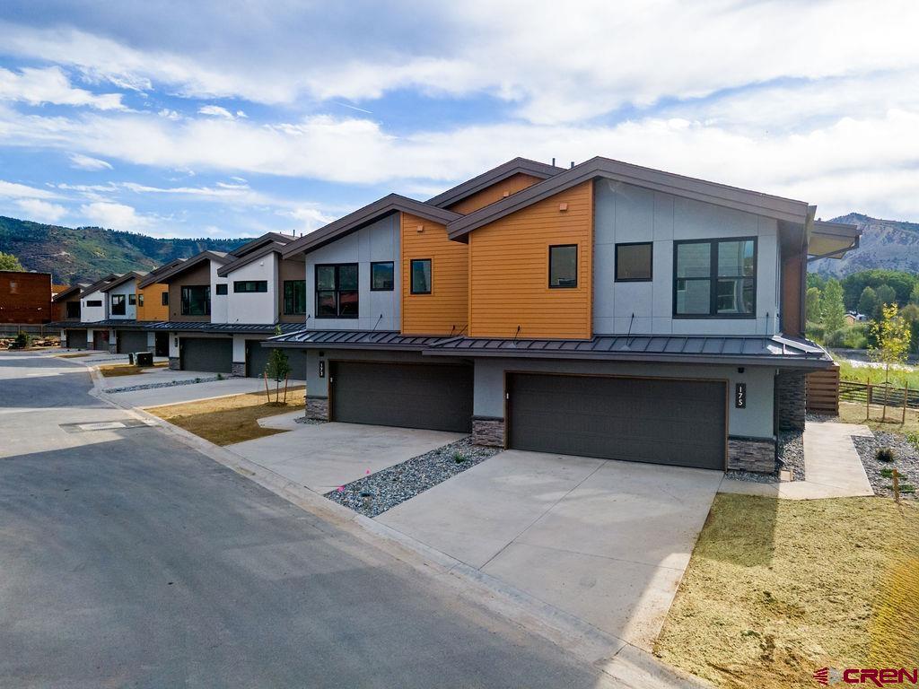 185 Riverfront Lane, Unit D1 B Ridgway, CO 81432 - Photo 12 of 35 a front view of a house with swimming pool