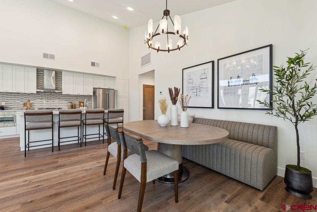 185 Riverfront Lane, Unit D1 B Ridgway, CO 81432 - Photo 14 of 35 a living room with furniture kitchen view and a chandelier