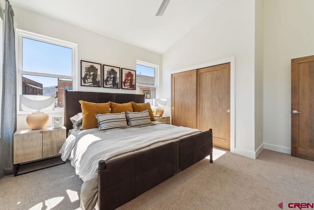 185 Riverfront Lane, Unit D1 B Ridgway, CO 81432 - Photo 18 of 35 a bedroom with bed and window