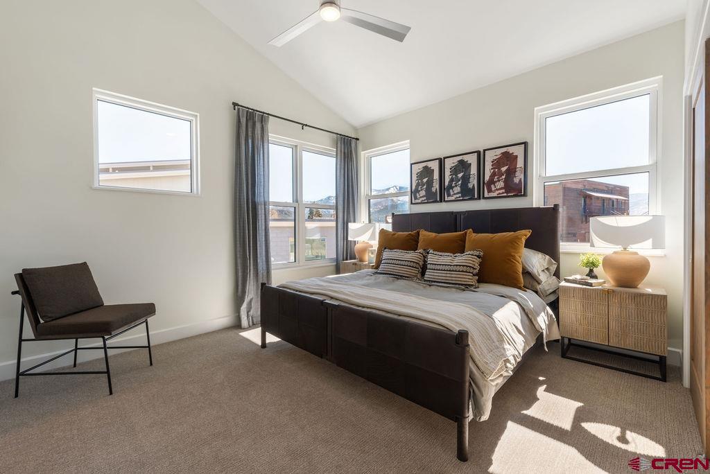 185 Riverfront Lane, Unit D1 B Ridgway, CO 81432 - Photo 19 of 35 a bedroom with a bed and a window