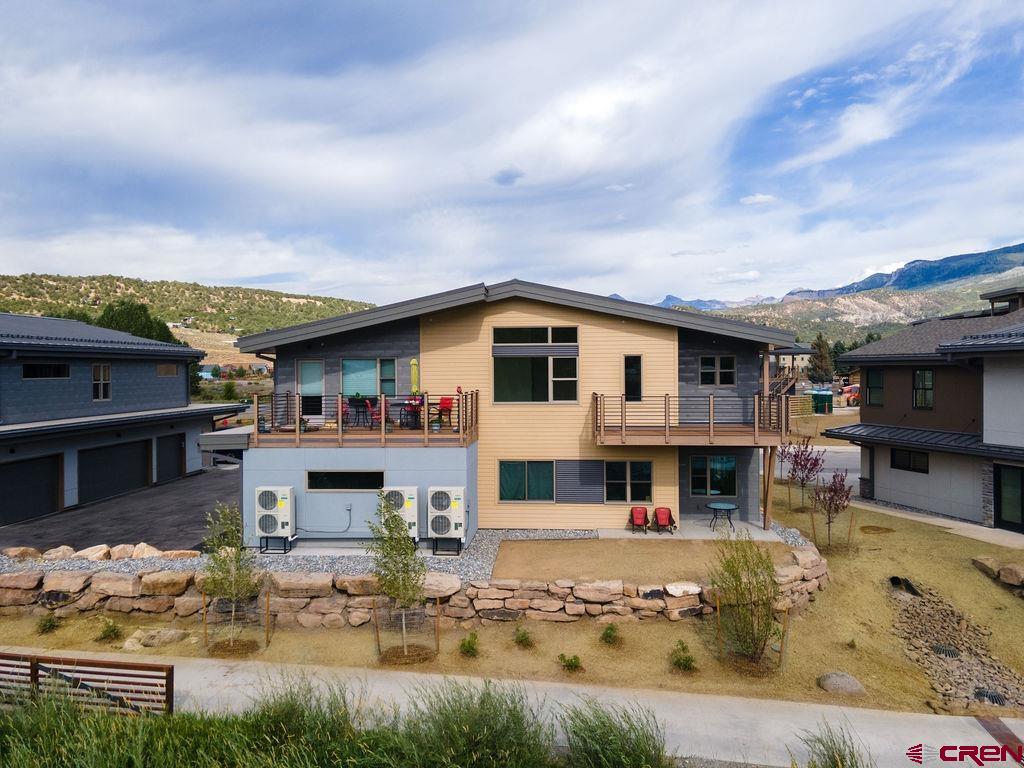 185 Riverfront Lane, Unit D1 B Ridgway, CO 81432 - Photo 24 of 35 a view of house with swimming pool in front of it