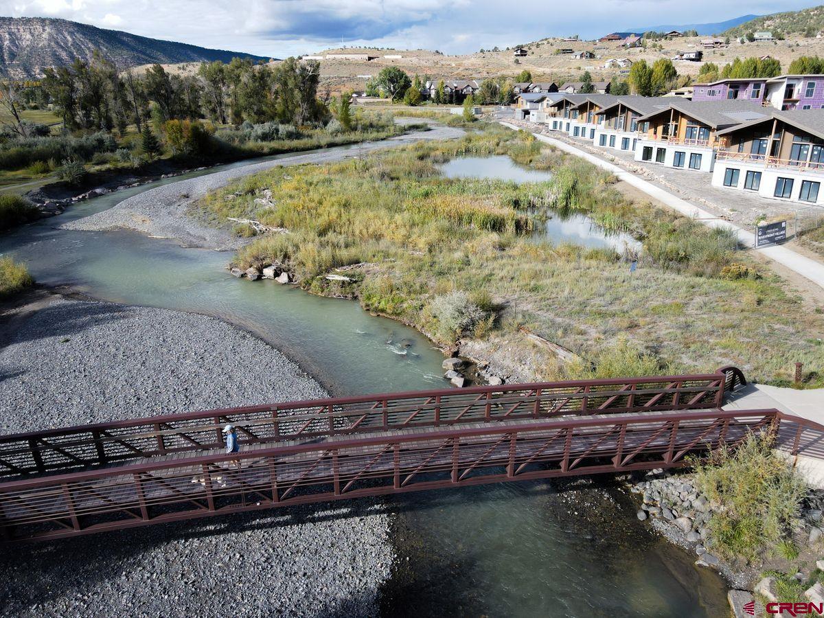 185 Riverfront Lane, Unit D1 B Ridgway, CO 81432 - Photo 31 of 35 a view of a lake with a mountain