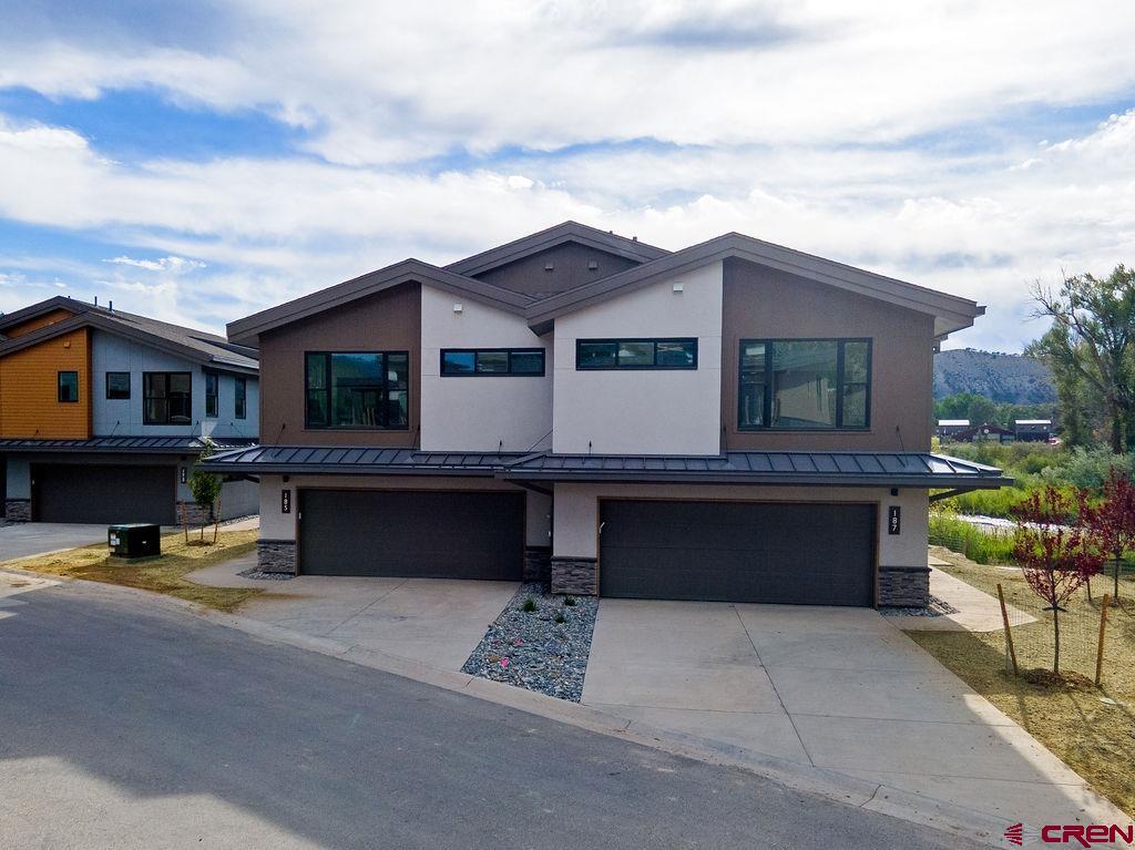 185 Riverfront Lane, Unit D1 B Ridgway, CO 81432 - Photo 8 of 35 a front view of house with yard