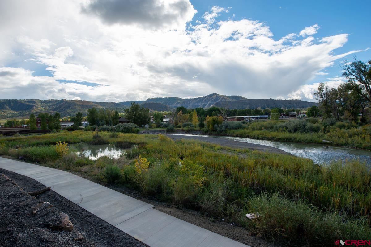 185 Riverfront Lane, Unit D1 B Ridgway, CO 81432 - Photo 9 of 35 a view of a lake with a city