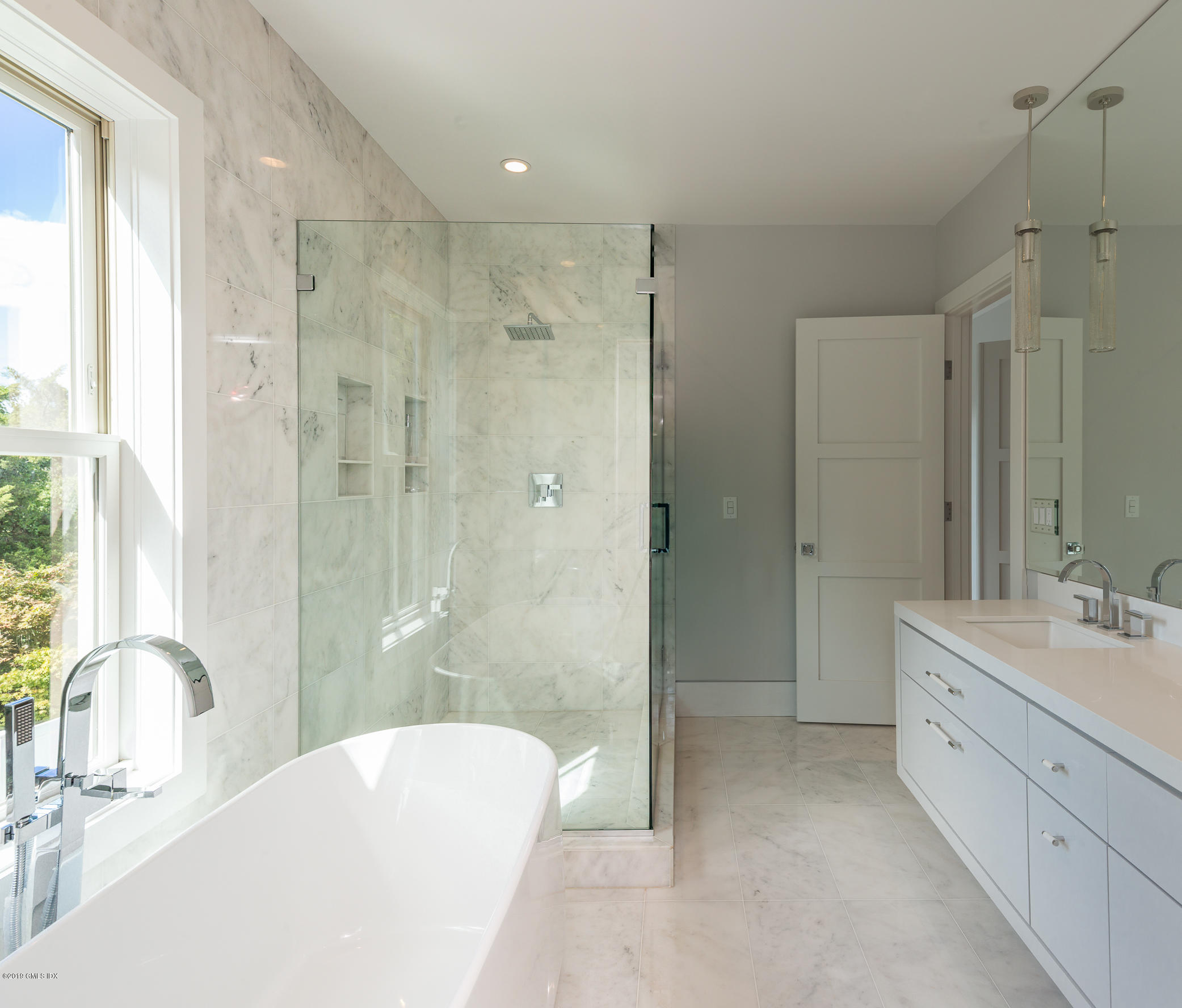 38 St Roch Avenue, Unit E Greenwich, CT 06830 - Photo 11 of 51 a bathroom with a bathtub shower sink mirror and toilet