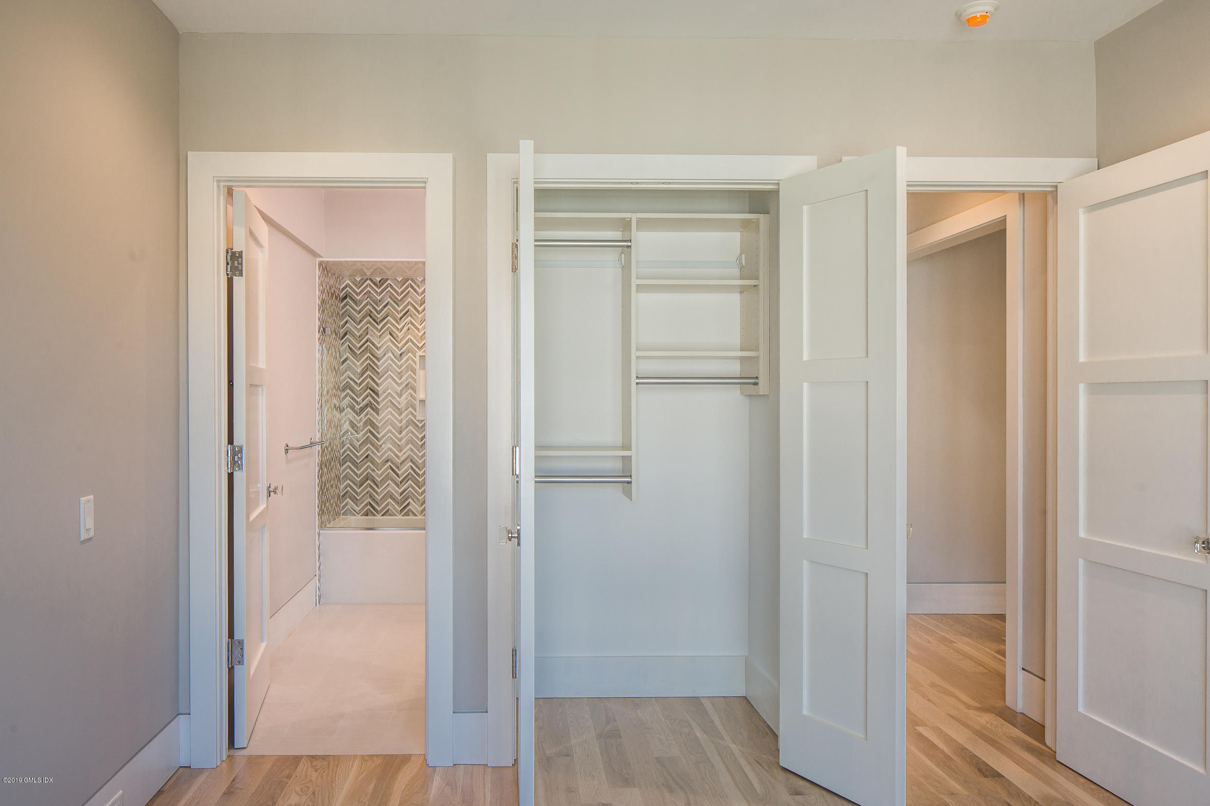 38 St Roch Avenue, Unit E Greenwich, CT 06830 - Photo 15 of 51 a view of a bathroom with a glass door