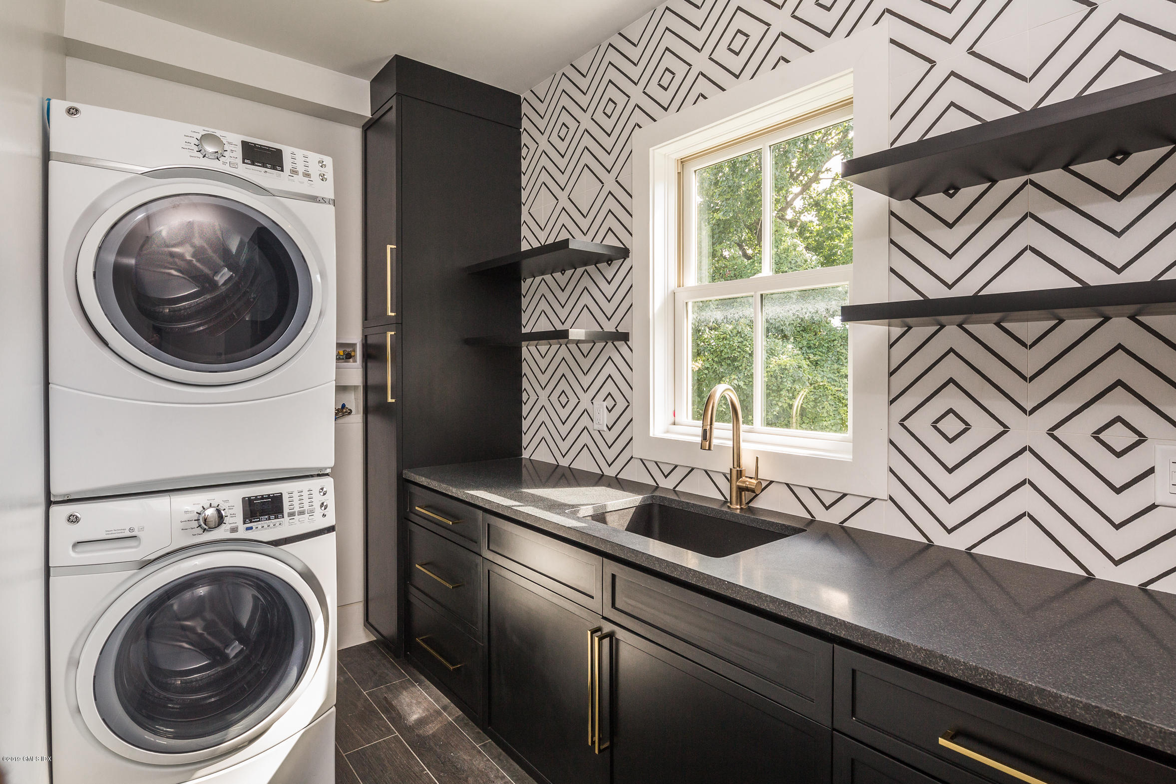 38 St Roch Avenue, Unit E Greenwich, CT 06830 - Photo 18 of 51 a view of a kitchen cabinets a sink and a stove