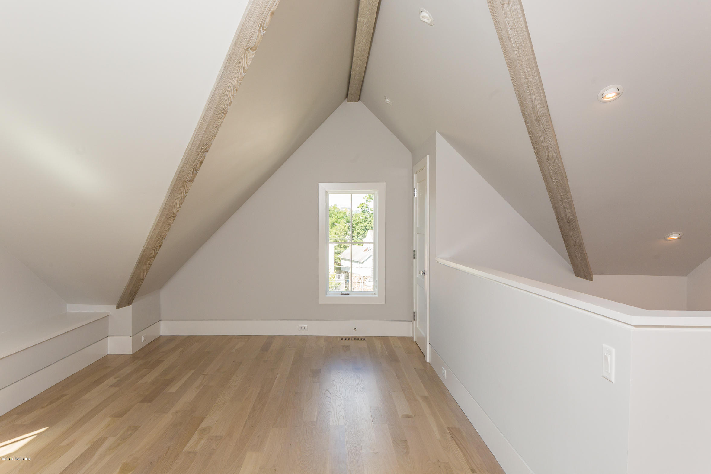 38 St Roch Avenue, Unit E Greenwich, CT 06830 - Photo 25 of 51 a view of entryway with wooden floor and stairs