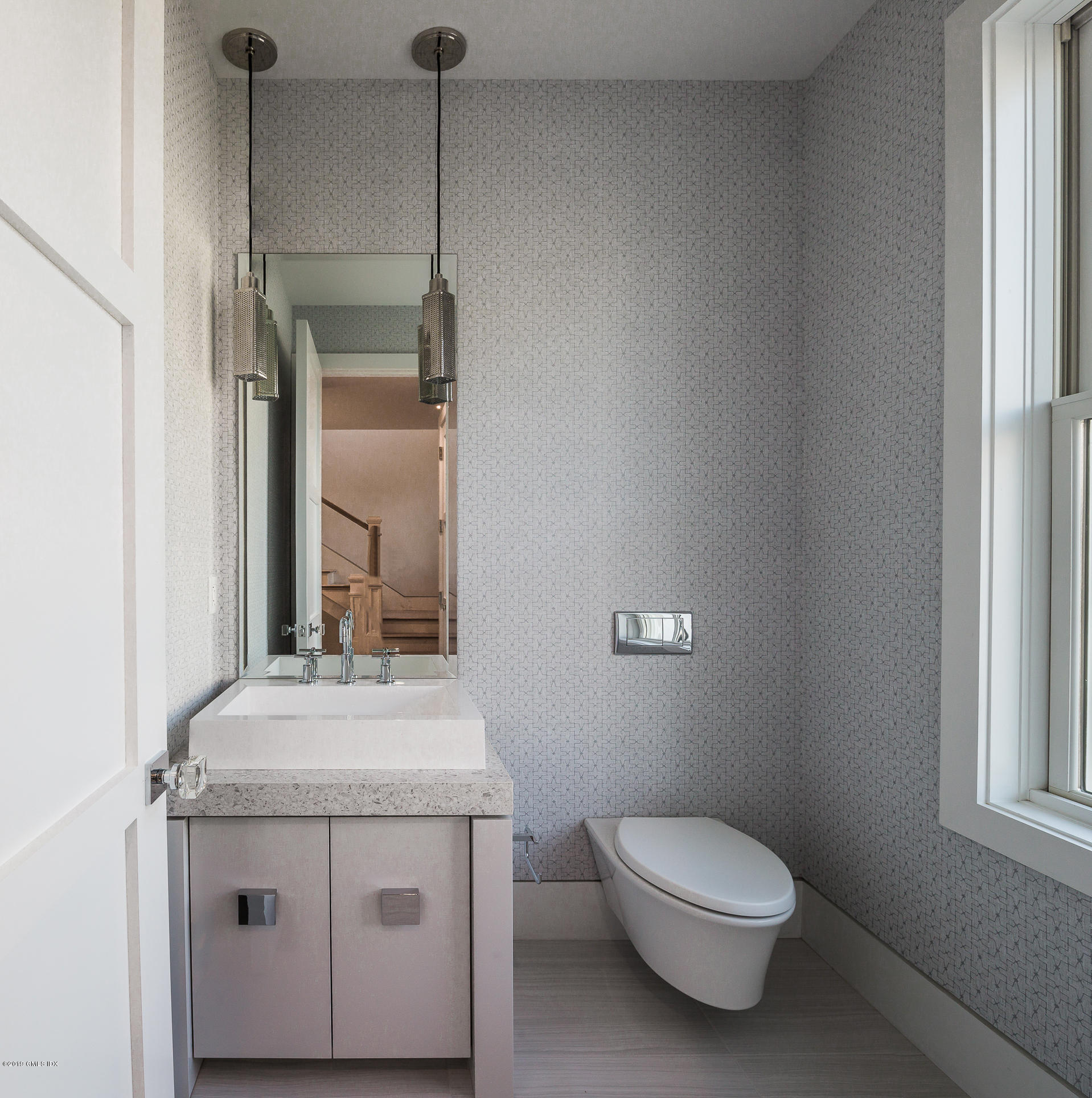 38 St Roch Avenue, Unit E Greenwich, CT 06830 - Photo 6 of 51 a bathroom with a sink a toilet and mirror