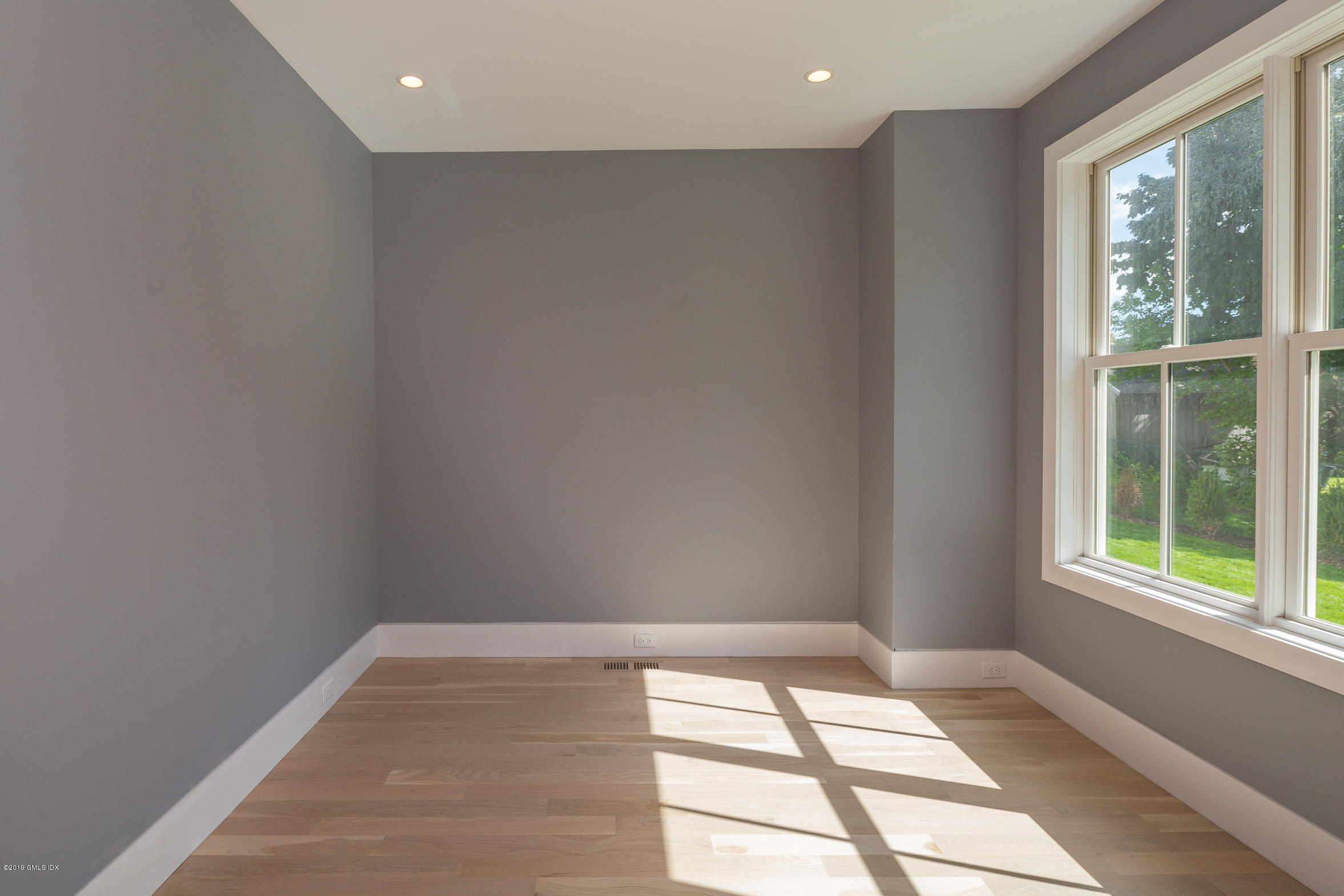 38 St Roch Avenue, Unit E Greenwich, CT 06830 - Photo 8 of 51 a view of an empty room and window