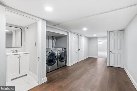 a view of a storage & utility room with washer and dryer
