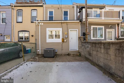 a front view of a house with a couch