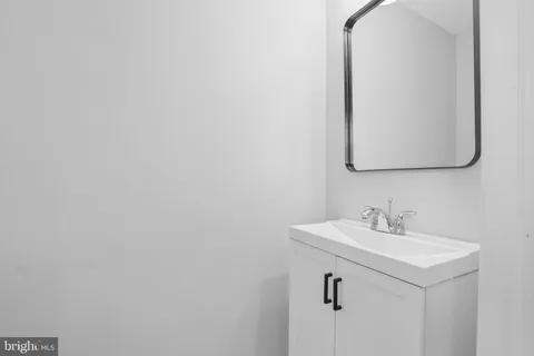 a bathroom with a sink and mirror