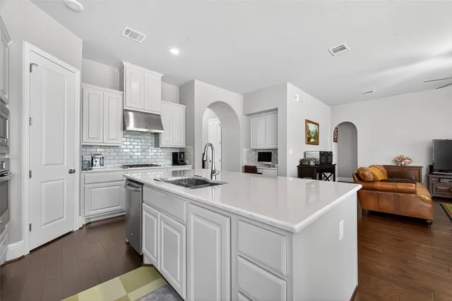 a view of a dining room with furniture and windows