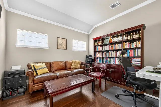 a bedroom with a bed and a chair