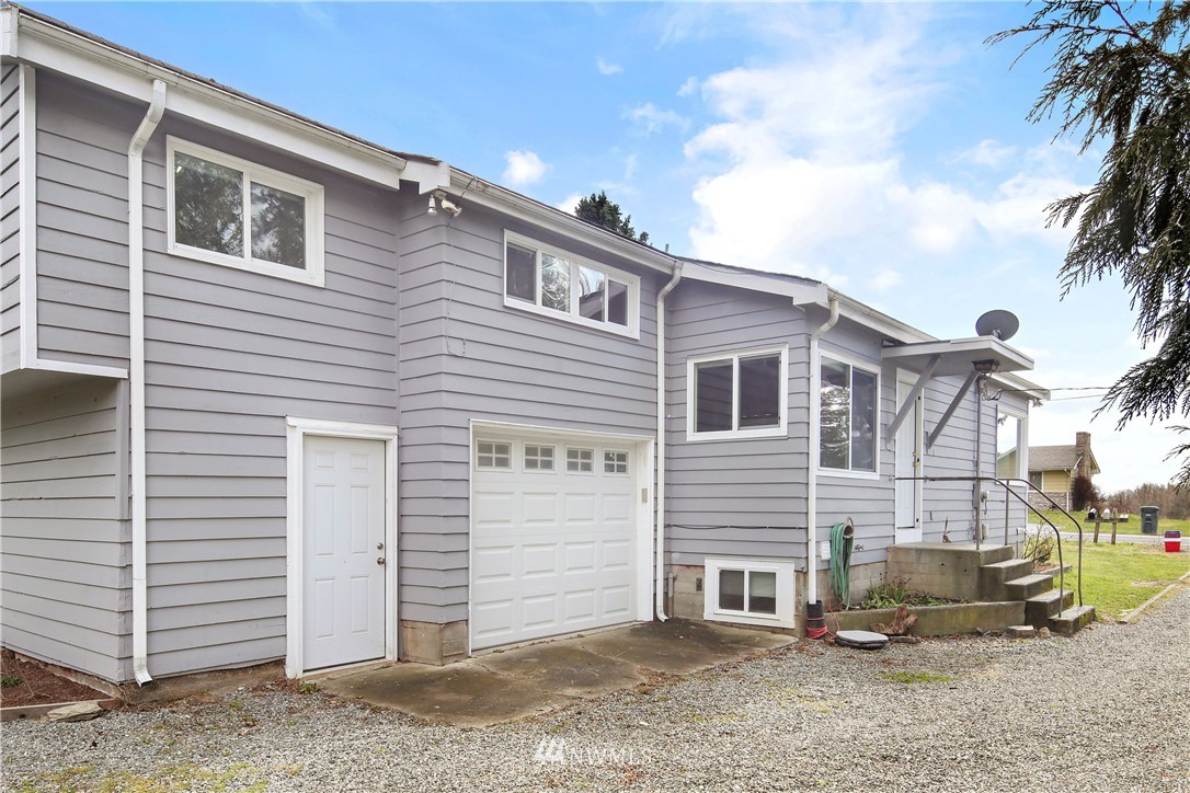 1606 Bayon Road Bellingham, WA 98225 - Photo 2 of 39 a view of a house with a backyard