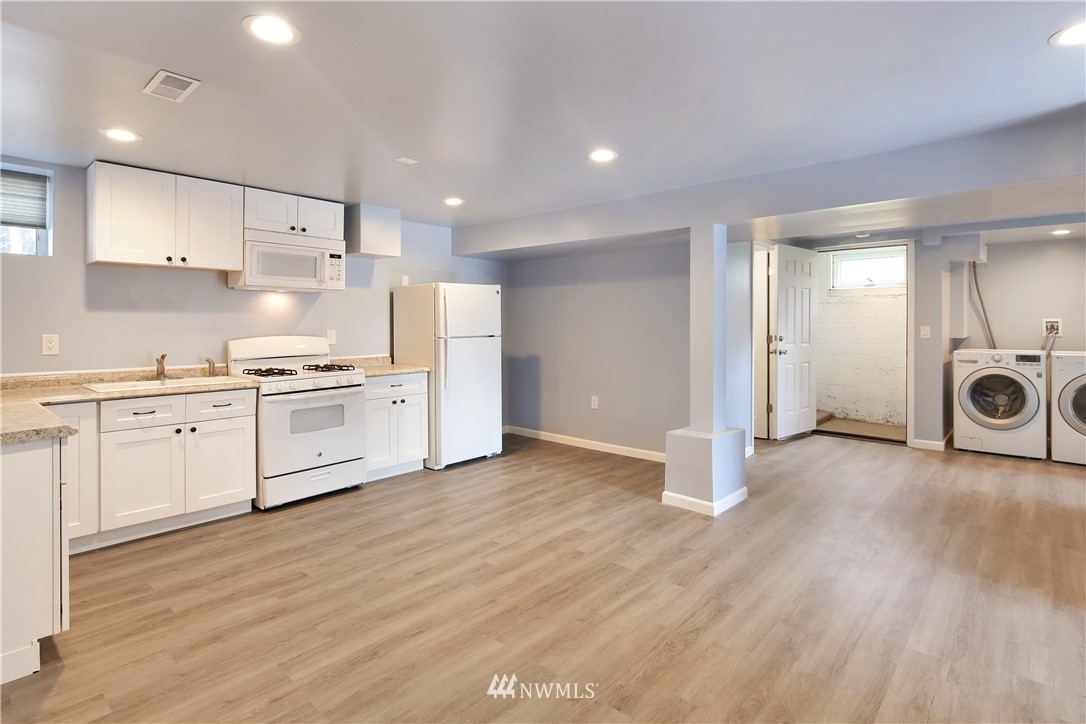 1606 Bayon Road Bellingham, WA 98225 - Photo 17 of 39 a kitchen with white cabinets and white appliances
