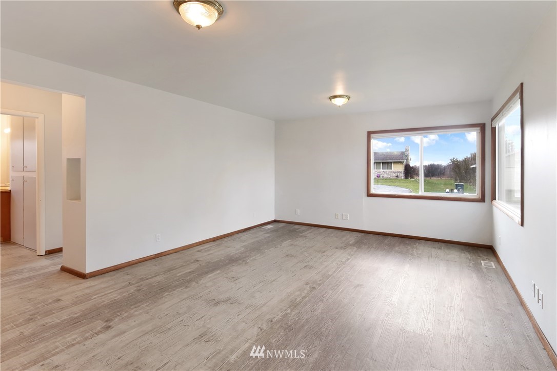 1606 Bayon Road Bellingham, WA 98225 - Photo 19 of 39 an empty room with wooden floor and windows
