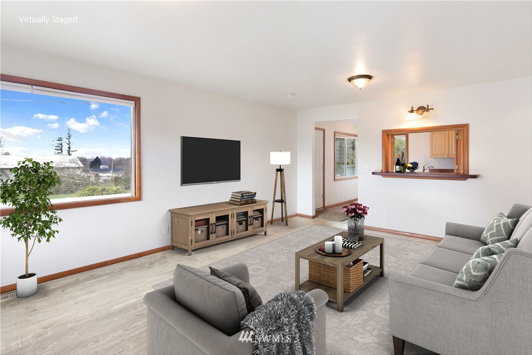 1606 Bayon Road Bellingham, WA 98225 - Photo 21 of 39 a living room with furniture and a flat screen tv