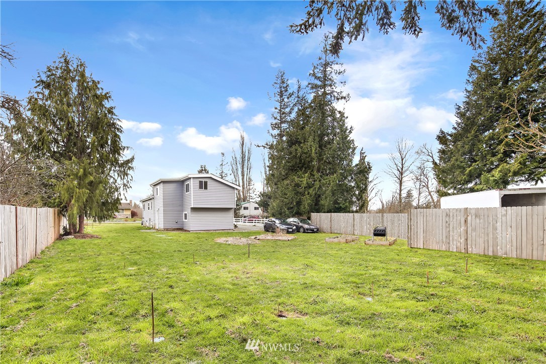 1606 Bayon Road Bellingham, WA 98225 - Photo 35 of 39 a view of a house with a big yard and a large tree