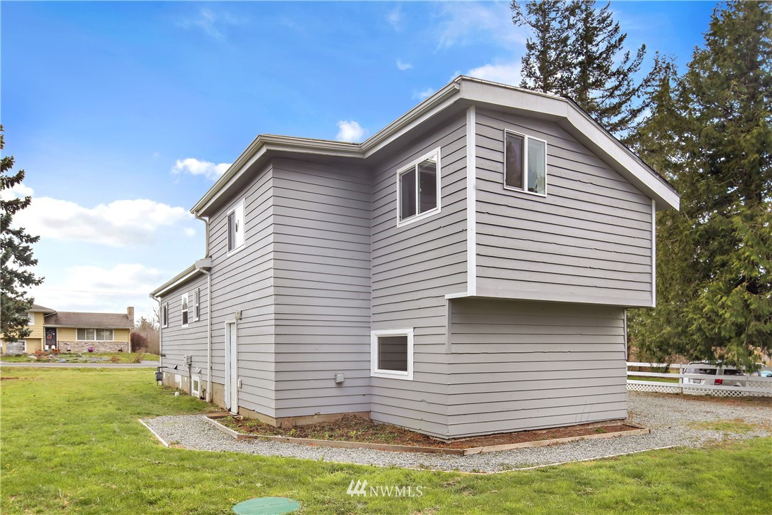 1606 Bayon Road Bellingham, WA 98225 - Photo 5 of 39 a front view of a house with a yard