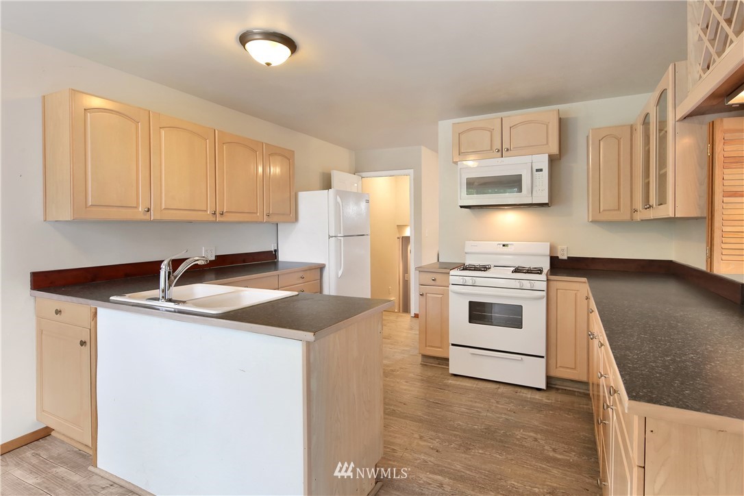 1606 Bayon Road Bellingham, WA 98225 - Photo 6 of 39 a kitchen with cabinets appliances a sink and a counter top space