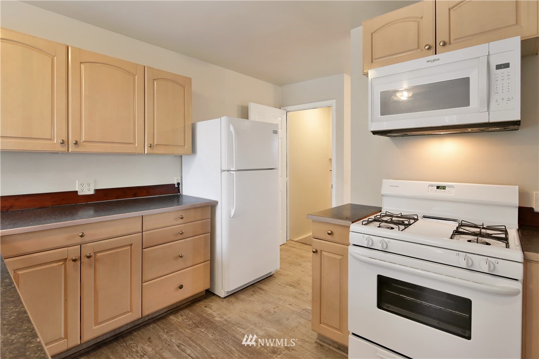 1606 Bayon Road Bellingham, WA 98225 - Photo 8 of 39 a kitchen with white cabinets and white appliances