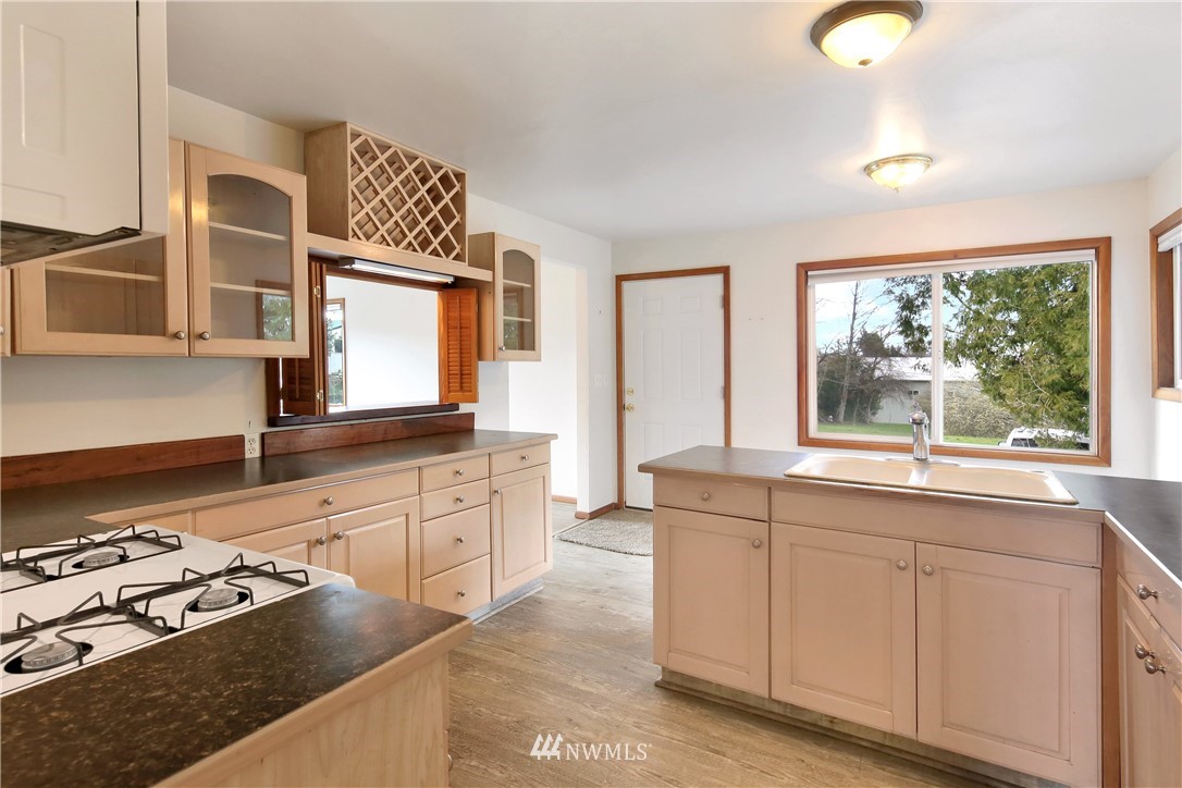 1606 Bayon Road Bellingham, WA 98225 - Photo 9 of 39 a kitchen with stainless steel appliances granite countertop a stove and a sink
