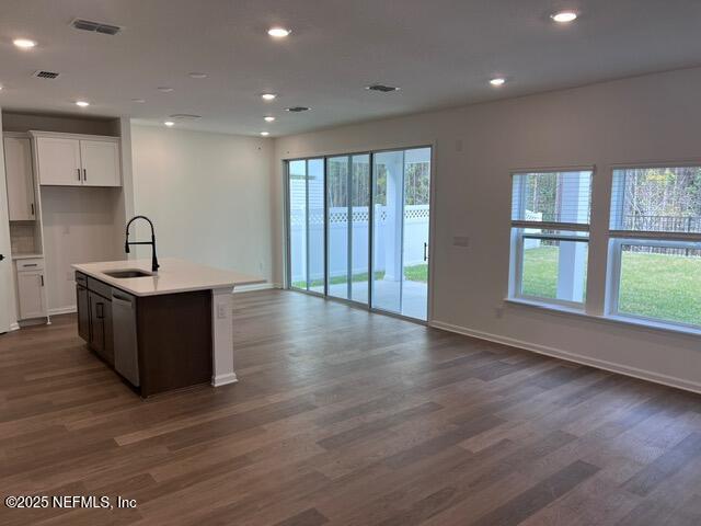 1177 Brk Frst Drive St. Augustine, FL 32092 - Photo 3 of 31 a kitchen with stainless steel appliances granite countertop a sink a stove and a wooden floors