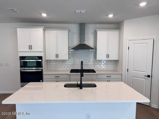 1177 Brk Frst Drive St. Augustine, FL 32092 - Photo 5 of 31 a kitchen with kitchen island a sink a stove and refrigerator